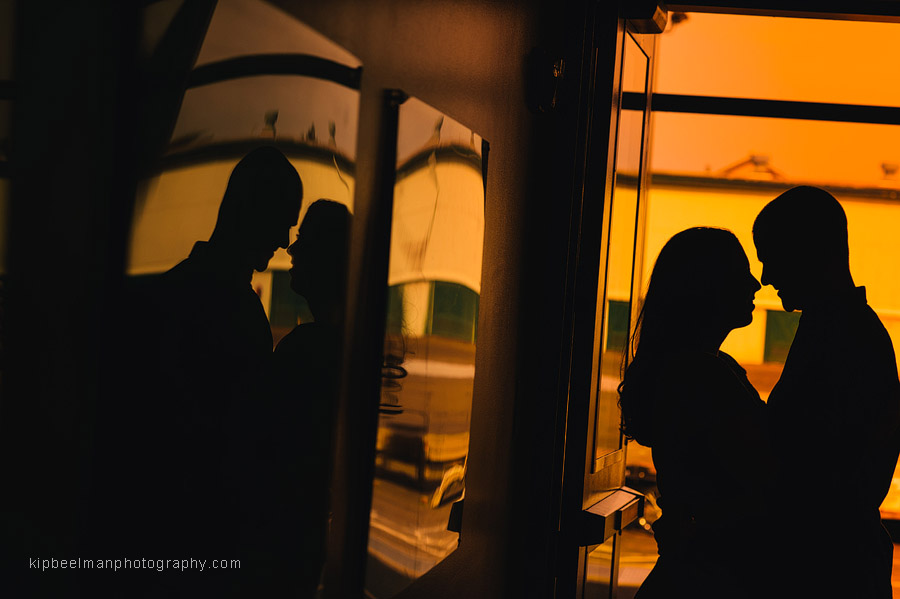 A moody silhouette of a couple embracing during their Fishermens Terminal engagement session