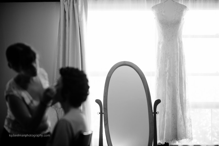 Black and White wedding dress hangs at the window